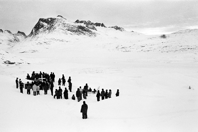 GREENLAND. Tiniteqilaaq. 2000. An old hunter is dead and most of the settlement is attending the funeral. The body is kept in the coffin until summer, when the ground gets soft and it is possible to bury the corpse.