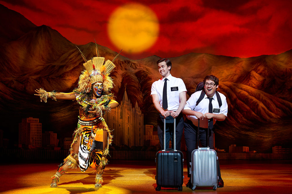 M Jae Cleopatra Isaac, Kevin Clay, Conner Peirson in The Book of Mormon. Credit: Paul Coltas