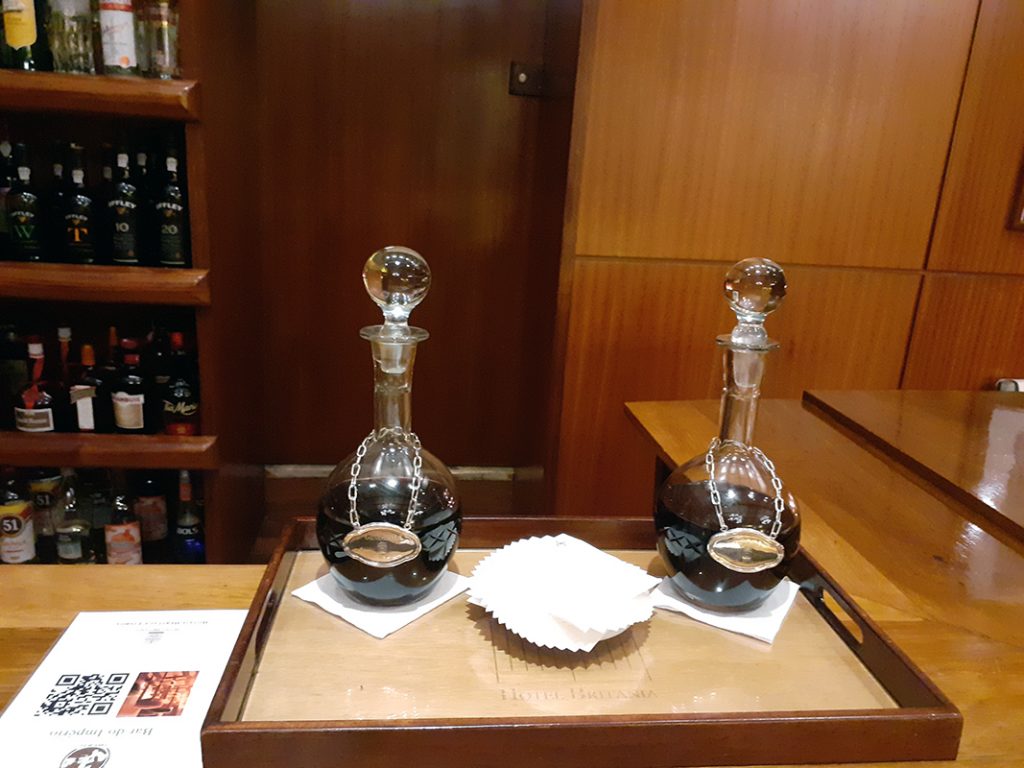 Decanters of Port and Ginjinah in the room at Britania Hotel, Lisbon