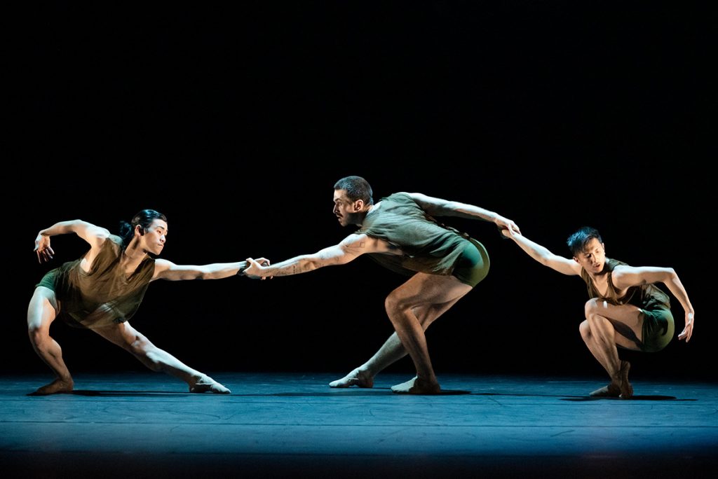 Rambert Dancers Max Day, Guillaume Queau and Jonathan Wade in Alonzo King's Following the Subtle Current Upstream Photography © Camilla Greenwell