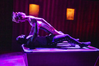 Chanel Waddock (Desdemona) and Michael Akinsulire (Othello) in Frantic Assembly's Othello. Photo Tristram Kenton