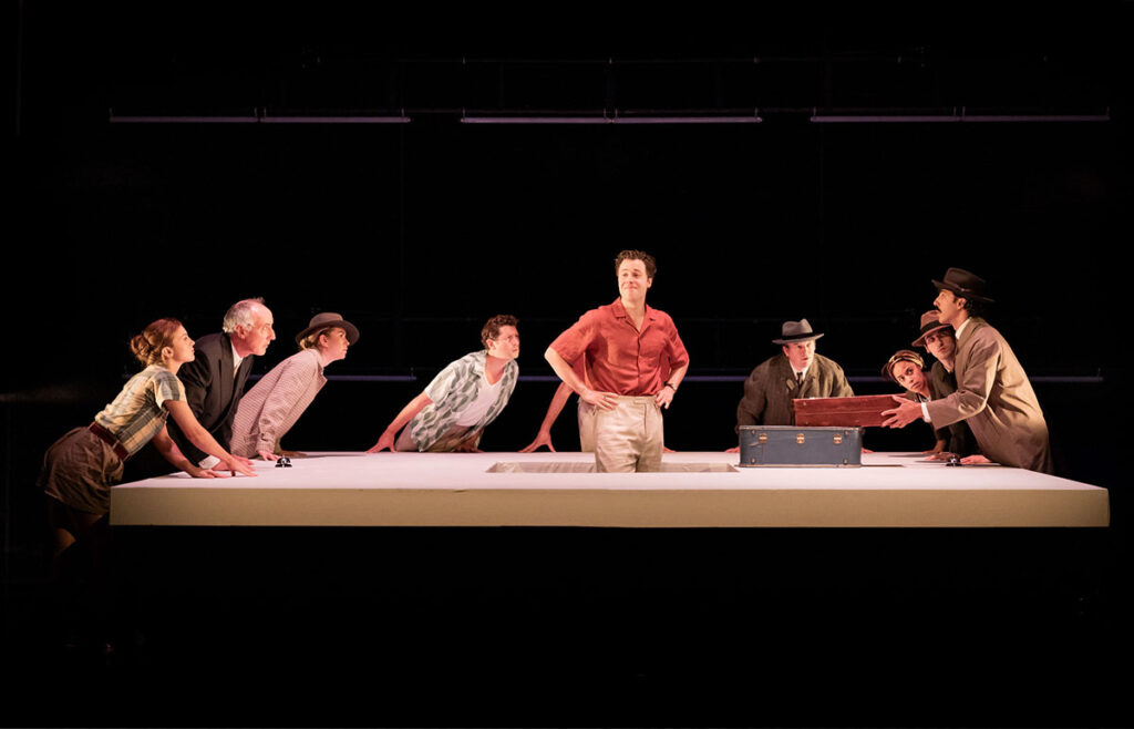 Ed McVey (centre) as Tom Ripley & the cast in THE TALENTED MR RIPLEY, credit Mark Senior