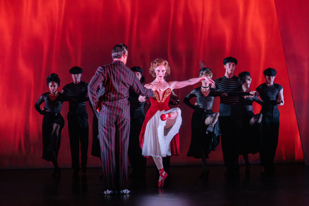 Matthew Bourne's production of THE RED SHOES. Ashley Shaw as Victoria Page and Company. Photo by Johan Persson