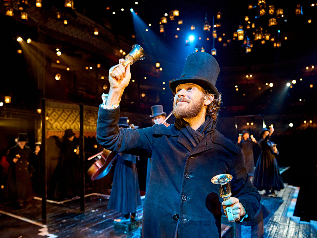 Rob Compton (Bob Cratchit) in A Christmas Carol at The Old Vic (2024). Photo by Manuel Harlan