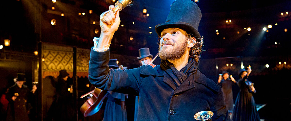 Rob Compton (Bob Cratchit) in A Christmas Carol at The Old Vic (2024). Photo by Manuel Harlan