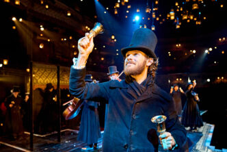 Rob Compton (Bob Cratchit) in A Christmas Carol at The Old Vic (2024). Photo by Manuel Harlan