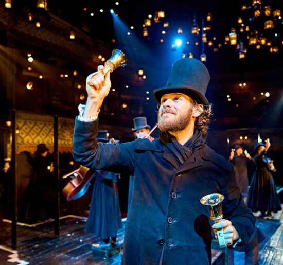 Rob Compton (Bob Cratchit) in A Christmas Carol at The Old Vic (2024). Photo by Manuel Harlan