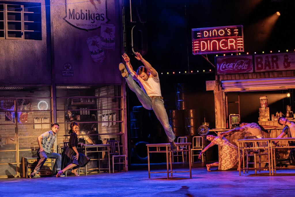 Matthew Bourne's THE CAR MAN. Harrison Dowzell (Luca) and Company. Photo by Johan Persson