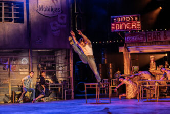 Matthew Bourne's THE CAR MAN. Harrison Dowzell (Luca) and Company. Photo by Johan Persson