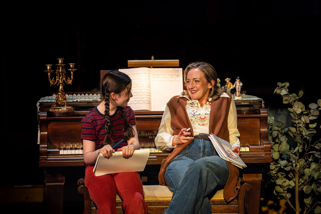 L-to-R Harriet O'Shea as Small Alison and Alex Young as Helen Bechdel in Fun Home at the Royal Exchange Theatre. Credit: Johan Persson