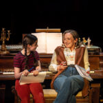 L-to-R Harriet O'Shea as Small Alison and Alex Young as Helen Bechdel in Fun Home at the Royal Exchange Theatre. Credit: Johan Persson