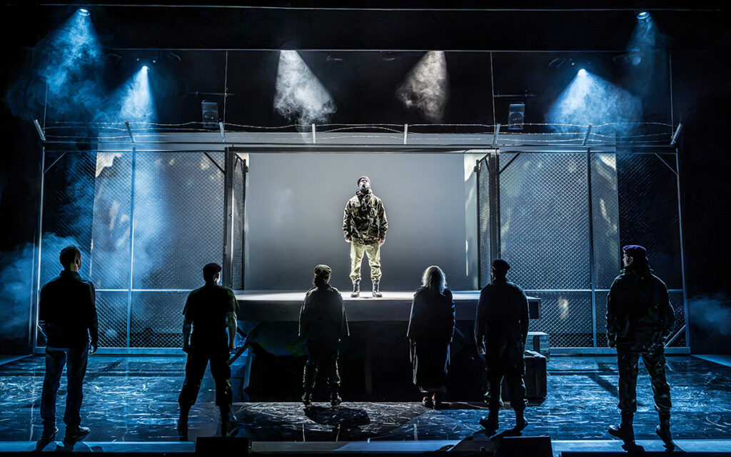 Dwane Walcott as Othello and ensemble. Photo credit Marc Brenner