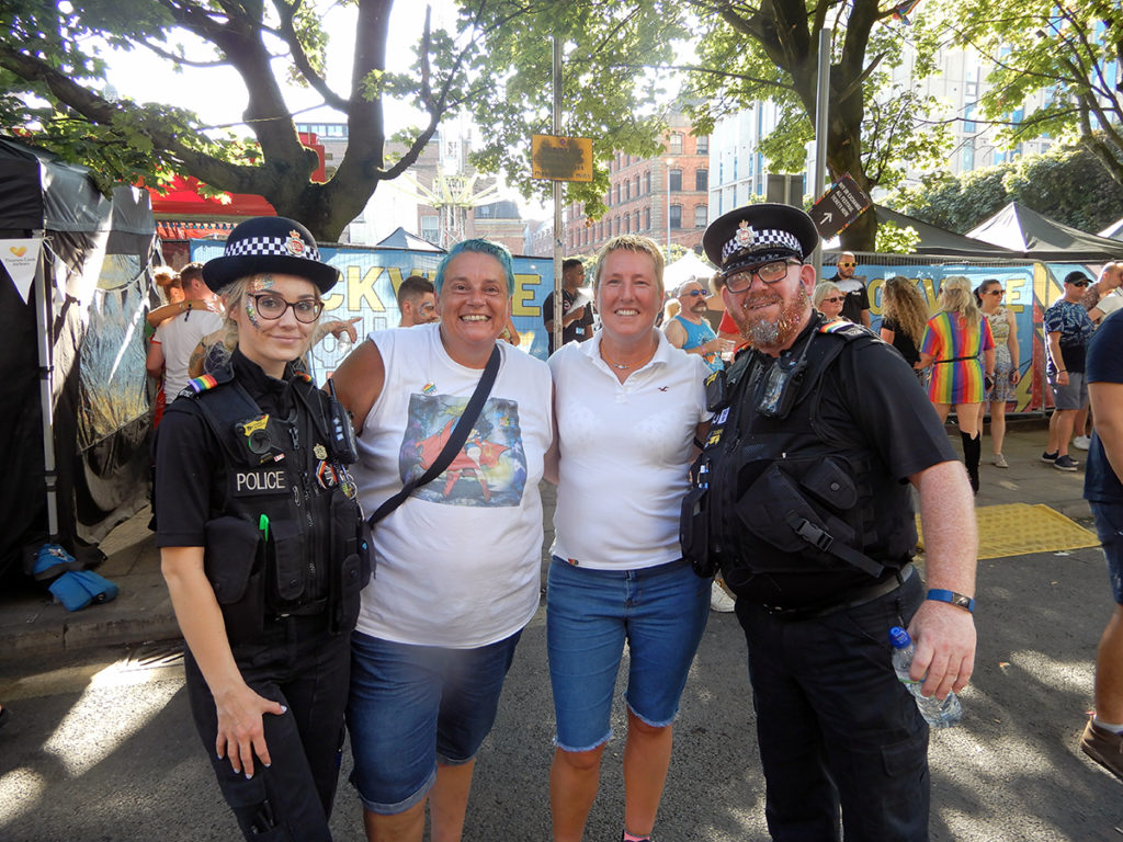 Liz and Georgie with officers from Manchester Police