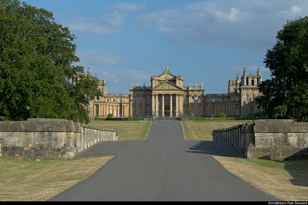 Blenheim Palace, viewed from the bridge. The facade of the building, with elegant portico, built in the 18th century English baroque style.