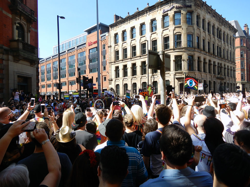 Crowds watching the Manchester Pride parade