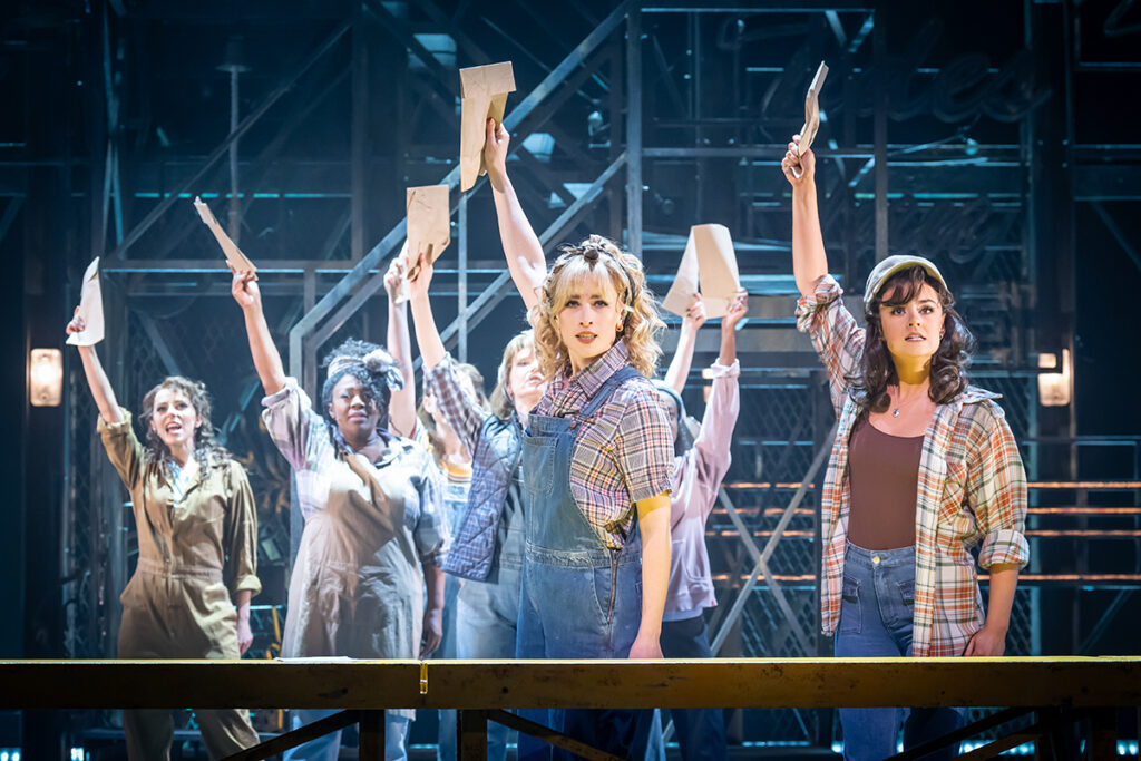 Front LtoR Sinead Long as Lynette Pomeroy & Georgia Lennon as Paula Pokrifki in An Officer and a Gentleman, credit Marc Brenner