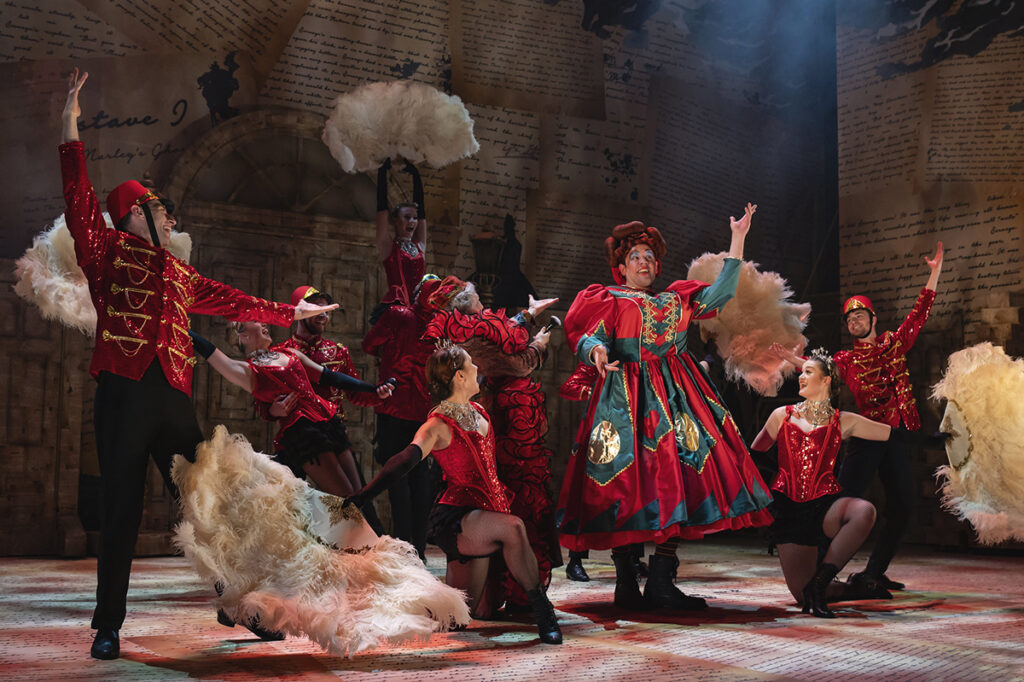 James Hume as Christmas Present and full ensemble. Photo by Matt Crockett