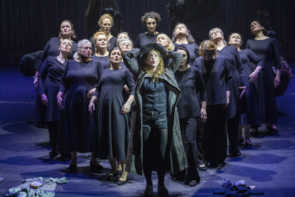 Opera North’s production of Wagner’s The Flying Dutchman. Layla Claire as Senta with the ladies of the Chorus of Opera North. Photo credit: James Glossop