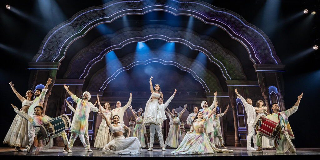 Jena Pandya, Ashley Day and Company of Come Fall in Love the DDLJ Musical Credit: Johan Persson